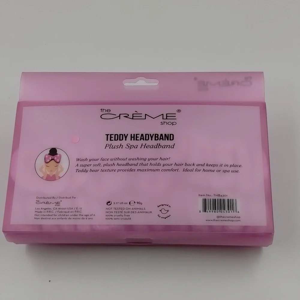 the Crème Shop teddy headband pink with smiley faces plush spa